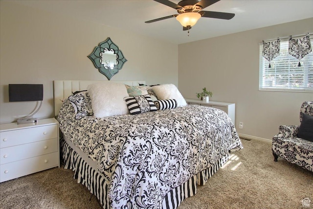 bedroom with carpet flooring, baseboards, and ceiling fan