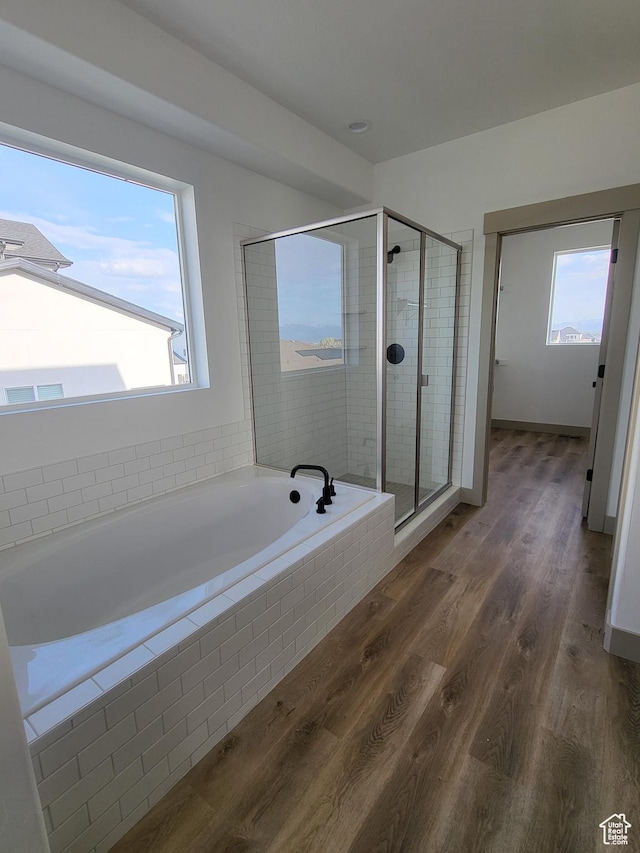 5682 W 7220 S, West Jordan, UT 84081 - bathroom featuring a bath, a stall shower, and wood finished floors