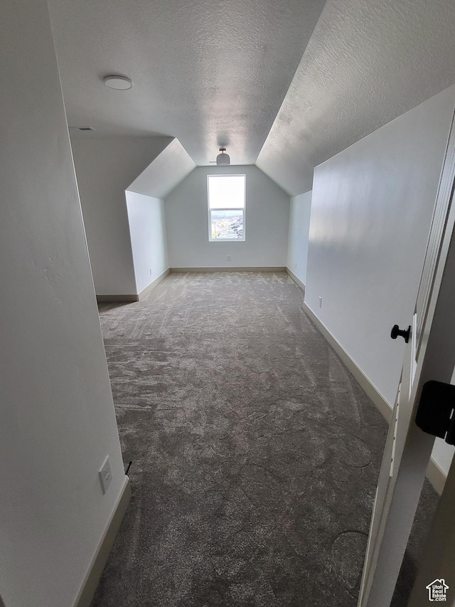 5682 W 7220 S, West Jordan, UT 84081 - bonus room featuring carpet, a textured ceiling, lofted ceiling, and baseboards