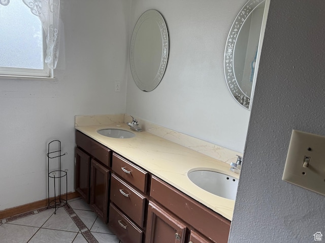 full bath with tile patterned flooring, a sink, and double vanity