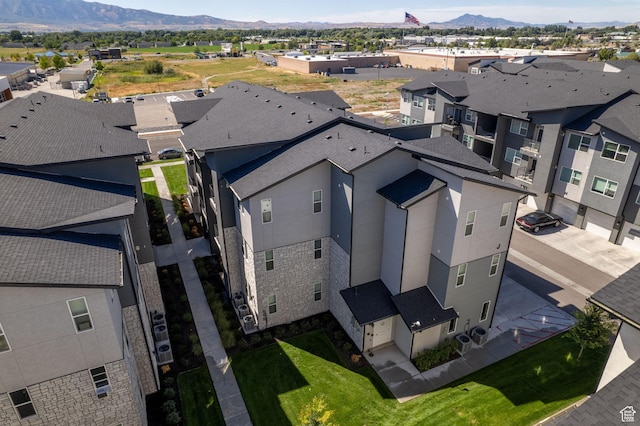 birds eye view of property with a residential view and a mountain view