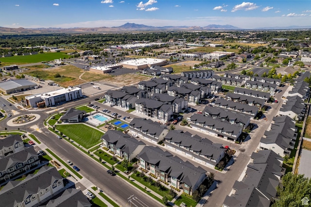 birds eye view of property with a mountain view and a residential view