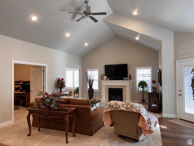 living area featuring a fireplace, baseboards, ceiling fan, and recessed lighting