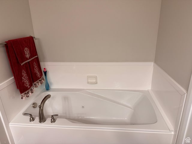 bathroom with a garden tub