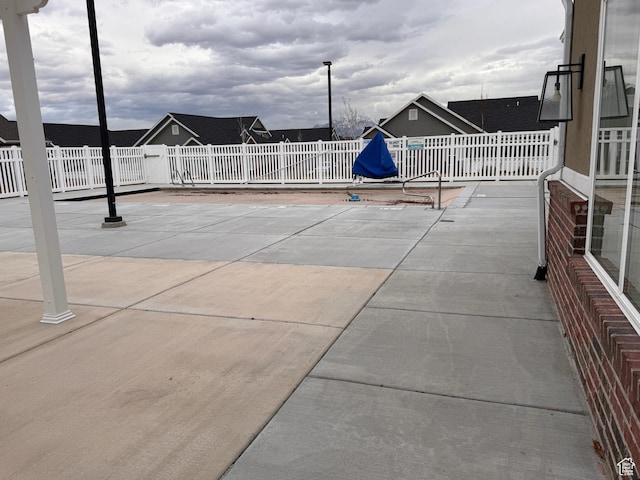view of patio / terrace featuring fence