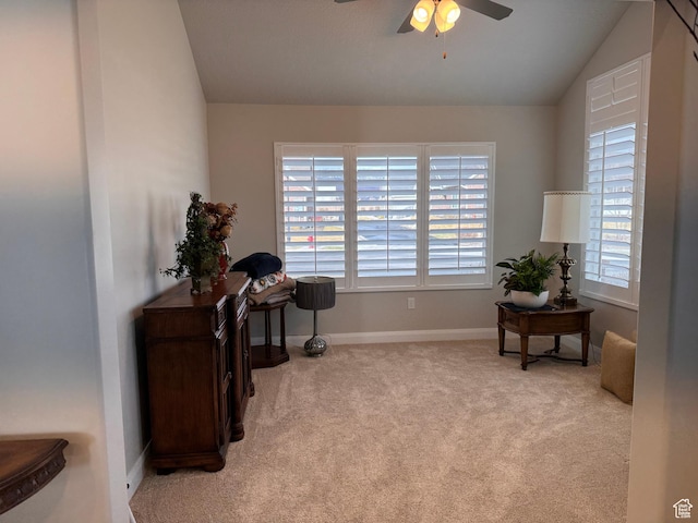 sitting room featuring ceiling fan, carpet floors, lofted ceiling, and baseboards