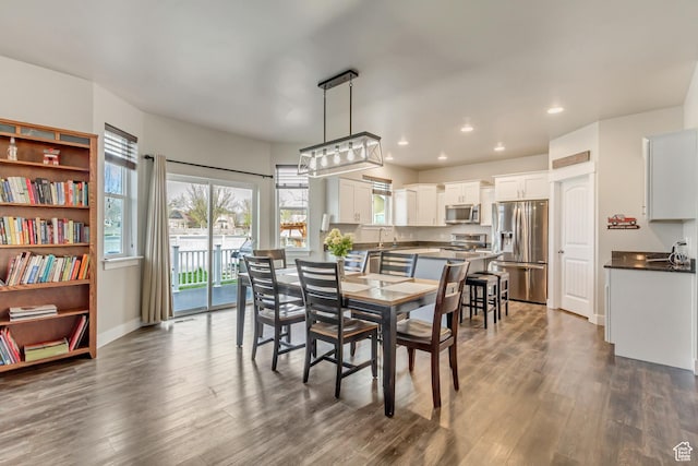 8459 N Western Gailes Dr, Eagle Mountain, UT 84005 - dining room featuring recessed lighting, baseboards, and dark wood-style floors