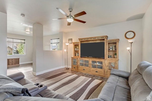8459 N Western Gailes Dr, Eagle Mountain, UT 84005 - living area featuring wood finished floors, a ceiling fan, and baseboards