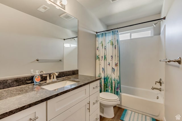 8459 N Western Gailes Dr, Eagle Mountain, UT 84005 - full bath with wood finished floors, visible vents, toilet, vanity, and shower / bath combo