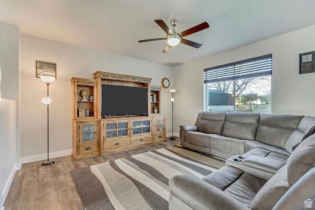 8459 N Western Gailes Dr, Eagle Mountain, UT 84005 - living room with wood finished floors, a ceiling fan, and baseboards