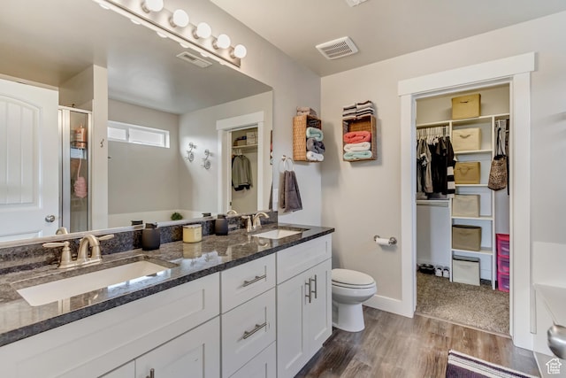 8459 N Western Gailes Dr, Eagle Mountain, UT 84005 - full bathroom with a shower stall, toilet, a sink, and visible vents