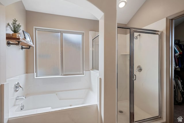 5701 W Emmeline Dr, Herriman, UT 84096 - bathroom featuring a bath, a spacious closet, and a shower stall