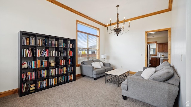 carpeted living area featuring crown molding, baseboards, and a notable chandelier