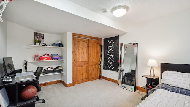 bedroom featuring light carpet and baseboards