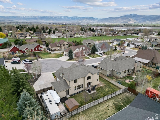 drone / aerial view featuring a mountain view and a residential view