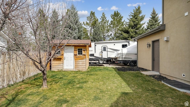 view of yard with an outdoor structure and fence
