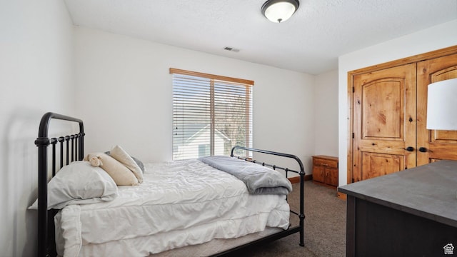 carpeted bedroom with visible vents