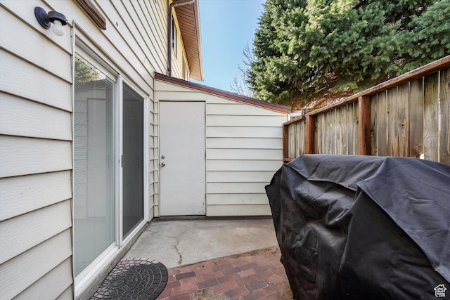 view of patio / terrace featuring fence