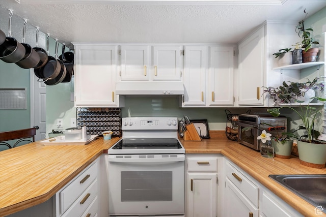 kitchen with extractor fan, electric stove, a sink, a textured ceiling, and white cabinetry