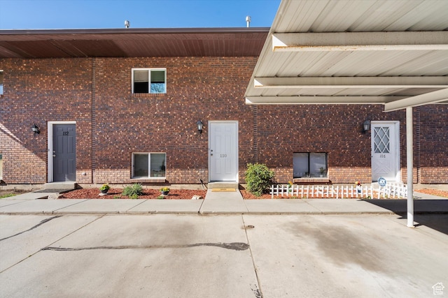exterior space with brick siding