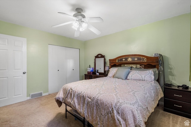 bedroom with a ceiling fan, a closet, carpet floors, baseboards, and visible vents