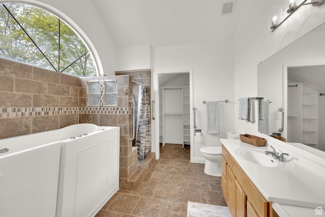 2590 W Central Pk Cir, Taylorsville, UT 84129 - bathroom with a bathtub, a tile shower, vanity, a spacious closet, and lofted ceiling
