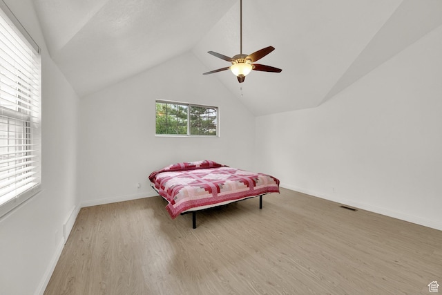 2590 W Central Pk Cir, Taylorsville, UT 84129 - bedroom with wood finished floors, vaulted ceiling, and ceiling fan