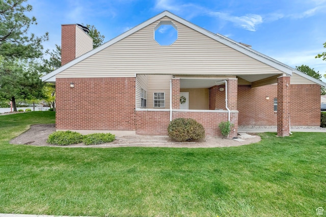 2590 W Central Pk Cir, Taylorsville, UT 84129 - view of side of property with brick siding, a chimney, and a yard