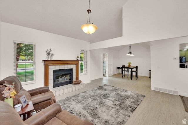 2590 W Central Pk Cir, Taylorsville, UT 84129 - living area featuring a fireplace and wood finished floors