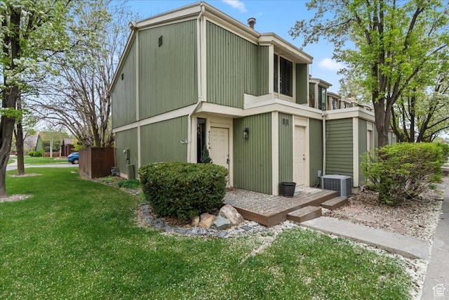 4216 S Solitude Rdg Unit A, Taylorsville, UT 84129 - view of front of home with a front lawn and central air condition unit