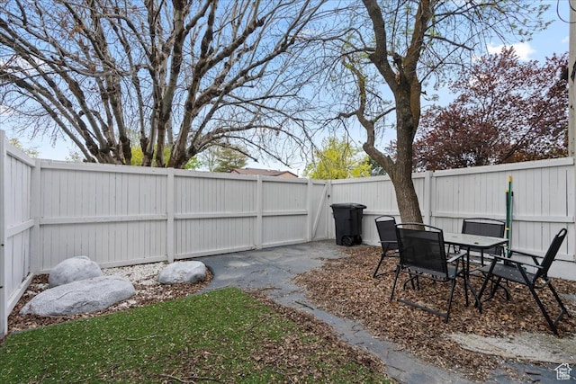 4216 S Solitude Rdg Unit A, Taylorsville, UT 84129 - view of yard with a fenced backyard and a patio