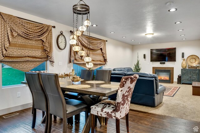 11113 S Cadbury Dr, South Jordan, UT 84095 - dining space featuring wood finished floors, a glass covered fireplace, baseboards, visible vents, and recessed lighting