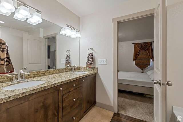 11113 S Cadbury Dr, South Jordan, UT 84095 - full bathroom with ensuite bathroom, wood finished floors, a sink, and double vanity
