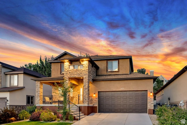 11113 S Cadbury Dr, South Jordan, UT 84095 - view of front of property featuring a garage, stone siding, concrete driveway, and stucco siding