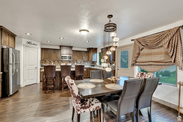 11113 S Cadbury Dr, South Jordan, UT 84095 - dining room with recessed lighting and dark wood-style flooring