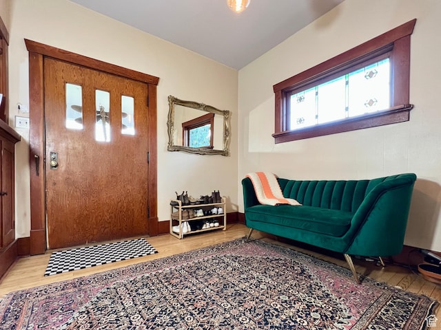 foyer with plenty of natural light and wood finished floors