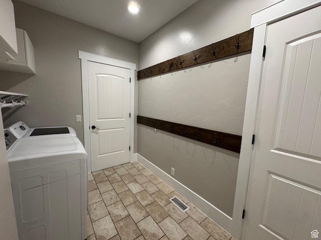 washroom featuring baseboards, laundry area, visible vents, and washer and clothes dryer
