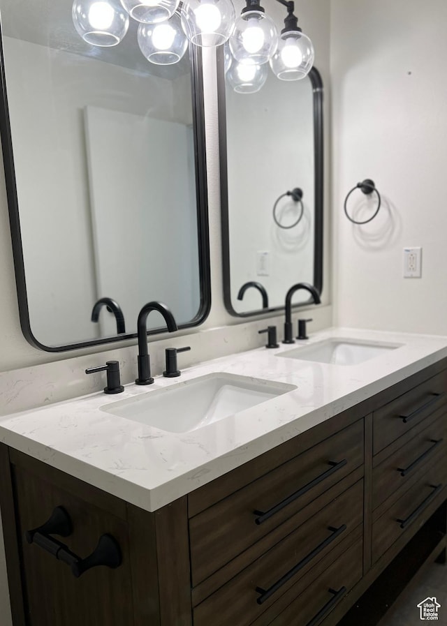 full bath with double vanity and a sink