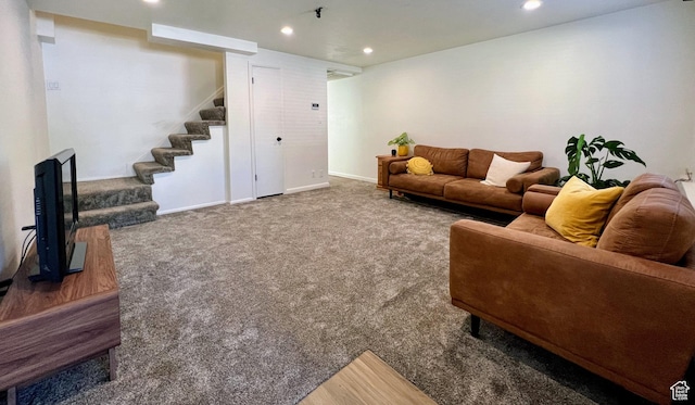 carpeted living area with recessed lighting, stairway, and baseboards