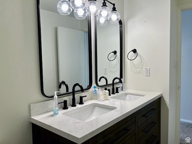 full bathroom featuring a sink and double vanity
