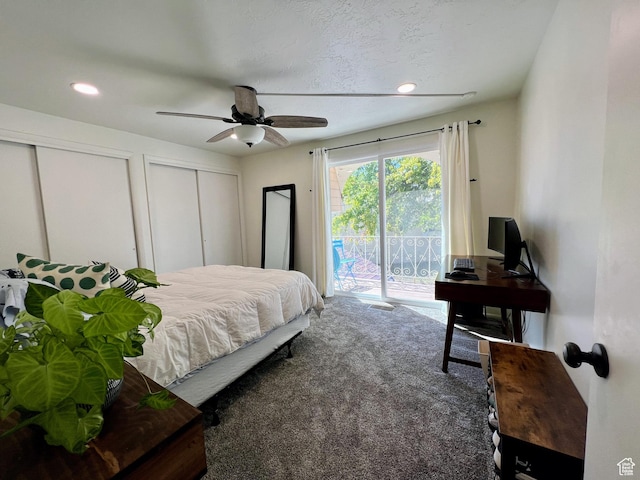 bedroom with carpet floors, recessed lighting, two closets, and access to exterior