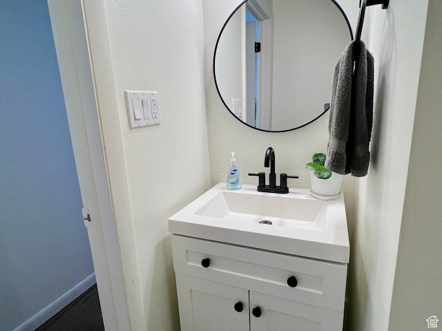bathroom with baseboards and vanity