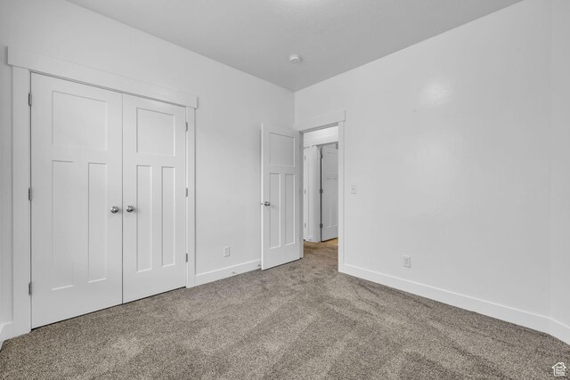 84 W Silver Springs Dr, Vineyard, UT 84059 - unfurnished bedroom with baseboards, carpet flooring, and a closet