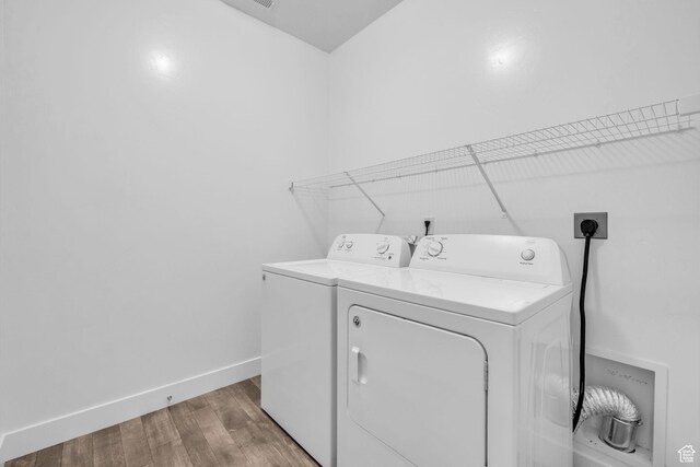 84 W Silver Springs Dr, Vineyard, UT 84059 - laundry area with separate washer and dryer, baseboards, light wood finished floors, and laundry area