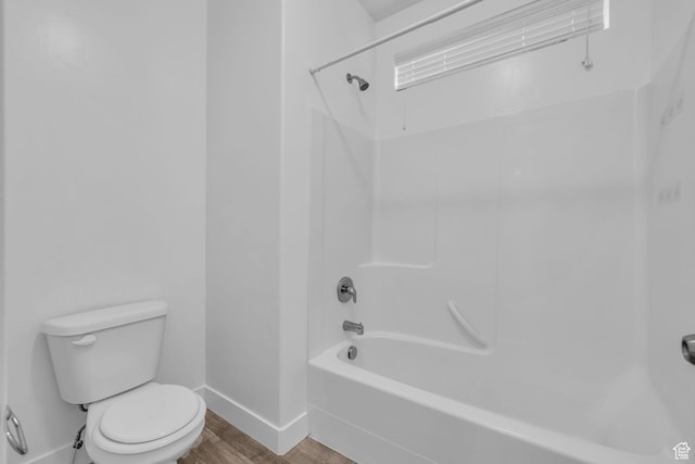84 W Silver Springs Dr, Vineyard, UT 84059 - full bathroom featuring toilet, wood finished floors, tub / shower combination, and baseboards