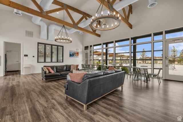 84 W Silver Springs Dr, Vineyard, UT 84059 - living area with high vaulted ceiling, a notable chandelier, beamed ceiling, and visible vents