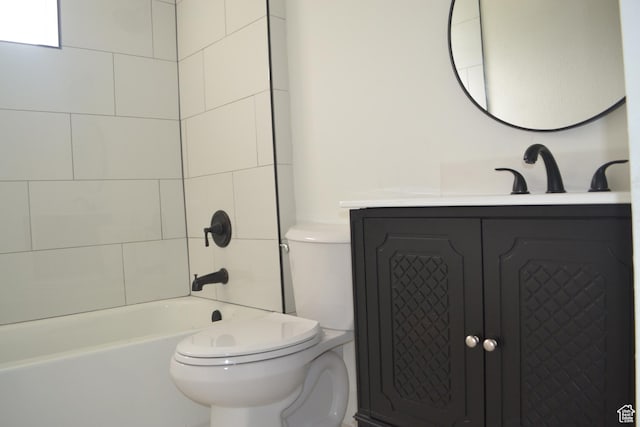 bathroom featuring toilet, vanity, and  shower combination