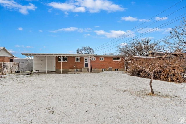 back of property featuring entry steps
