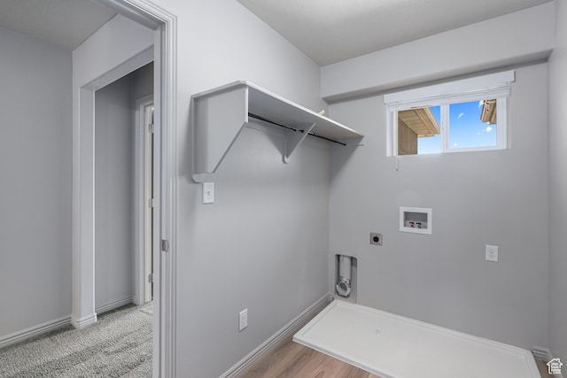 clothes washing area featuring baseboards, electric dryer hookup, laundry area, and washer hookup