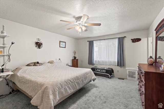 214 N Mountain Rd, Fruit Heights, UT 84037 - carpeted bedroom featuring a textured ceiling, baseboards, and ceiling fan